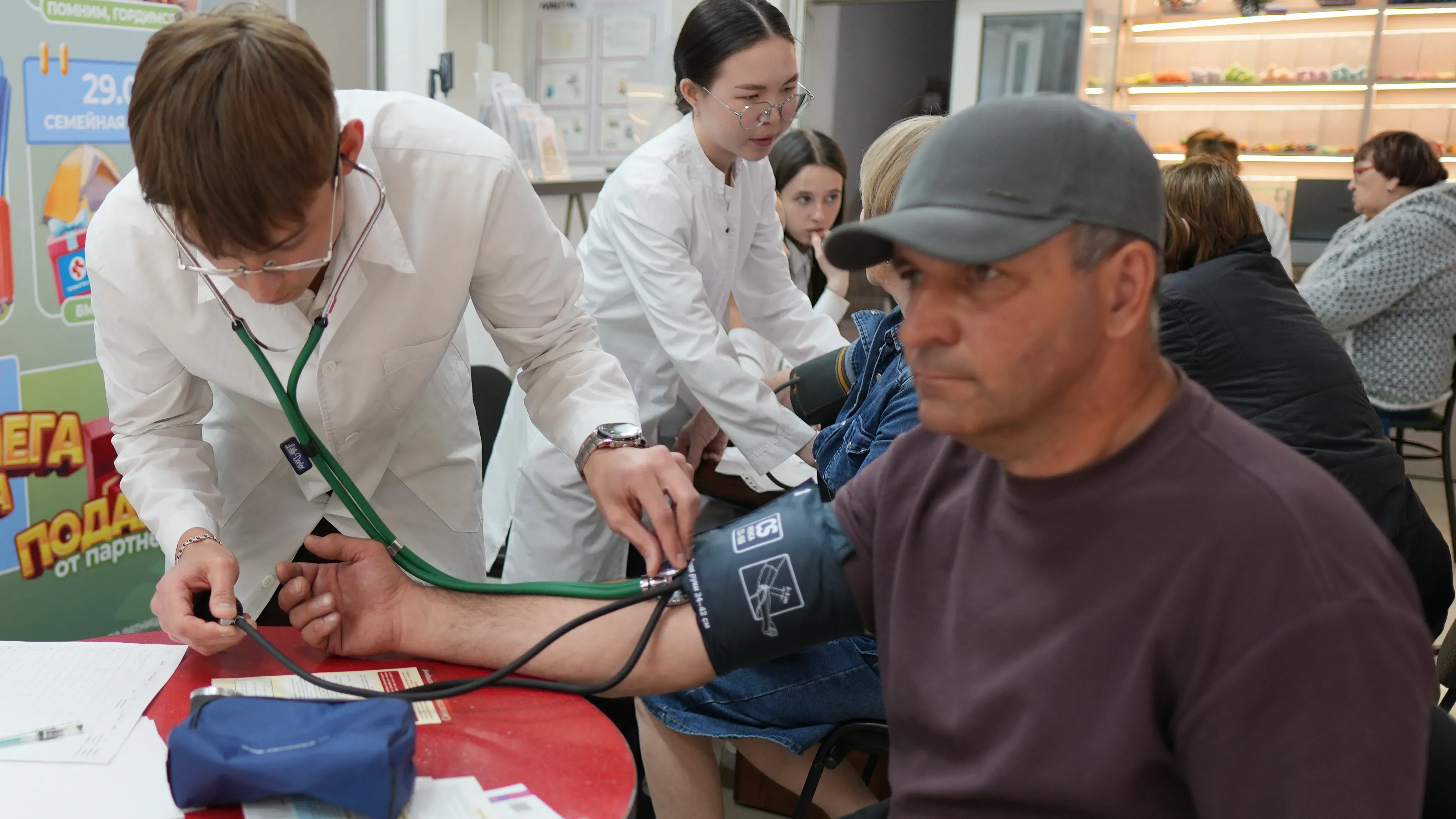 Amur State Medical Academy students measuring blood pressure during World Hypertension Day campaign in Blagoveshchensk