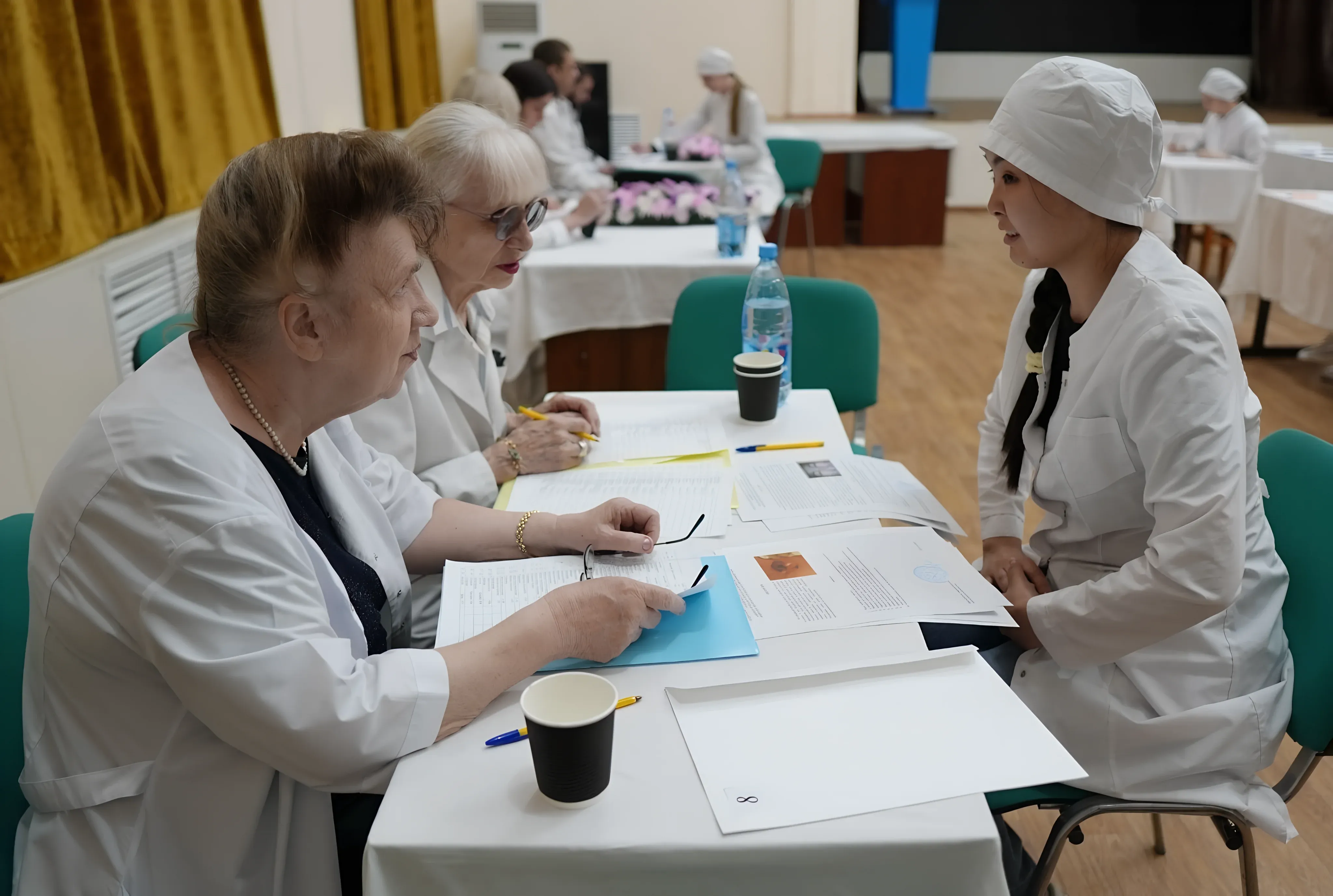 Examination committee evaluating medical students